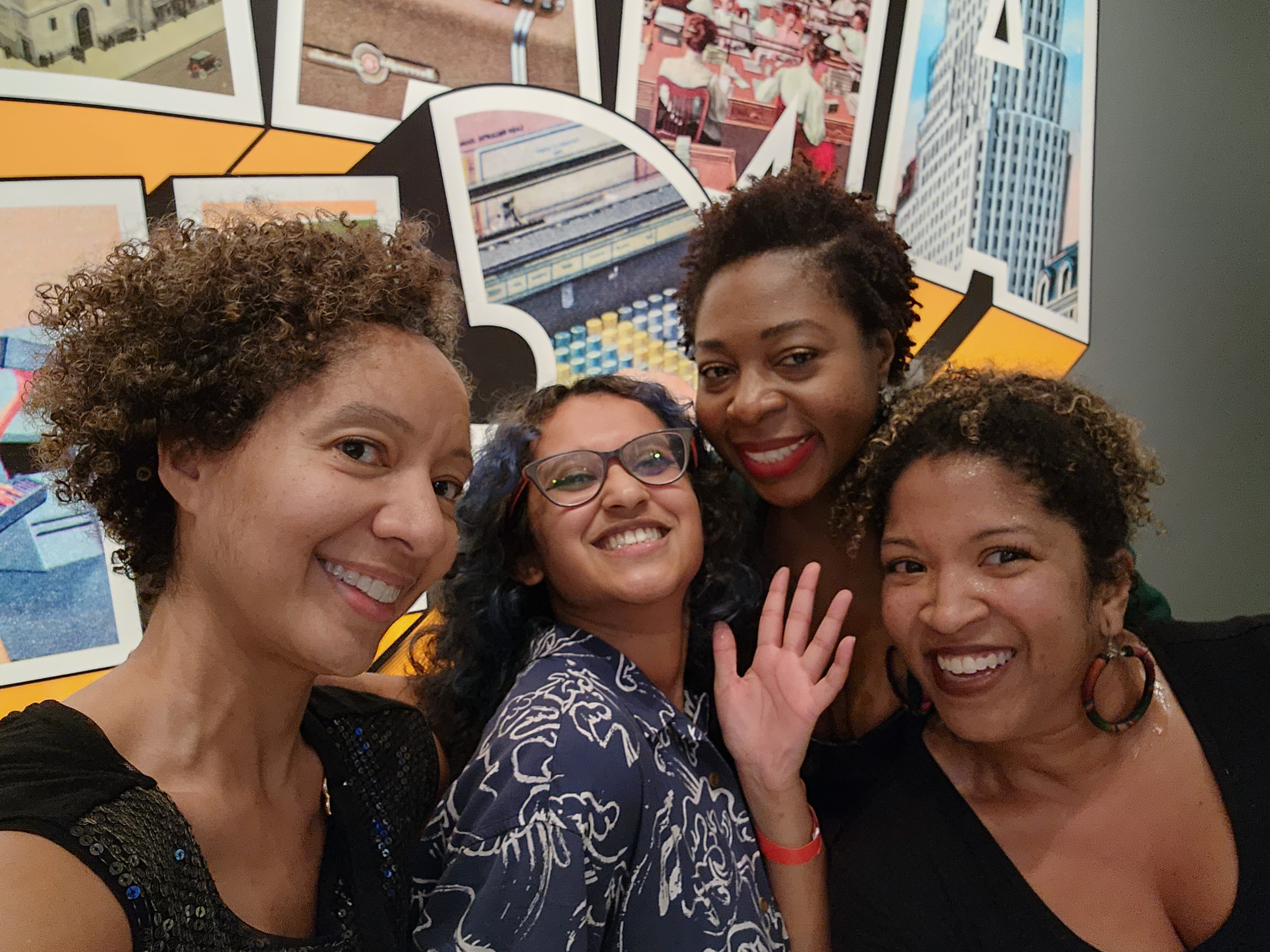 Four women pose for a photo